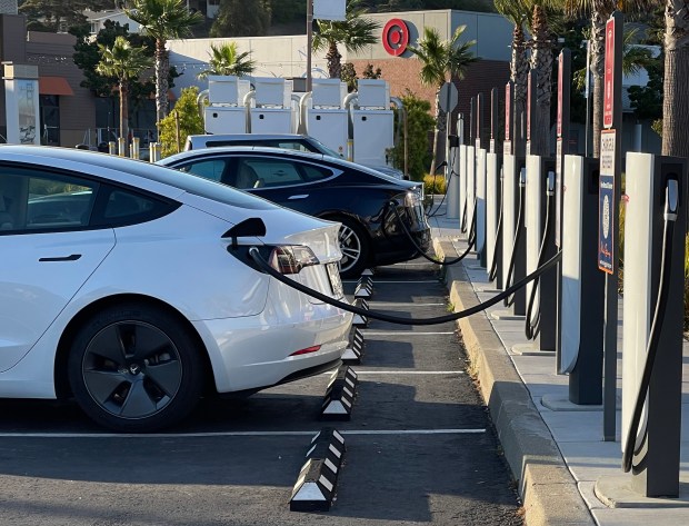 Electric cars recharge at a Tesla charging station at the Gateway Shopping Center in Marin City on Thursday, Aug. 26, 2021. (Alan Dep/Marin Independent Journal)