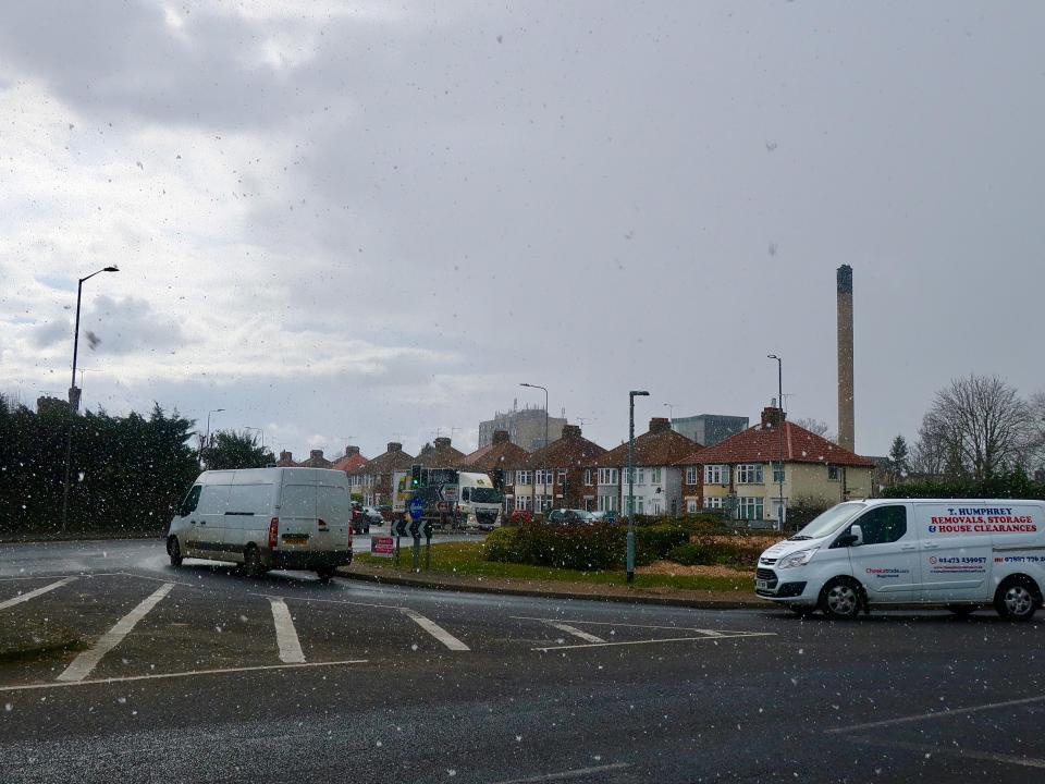 Snow falling on Woodbridge Road in Ipswich, Suffolk.