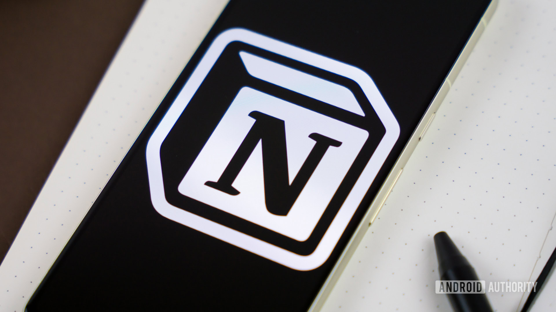 Notion logo on snartphone next to other office products Stock photo 6